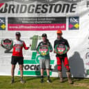 Martin Barr pictured with Brad Todd and Tom Grimshaw after winning the Pro MX1 Bridgestone British Masters at Hawkstone Park