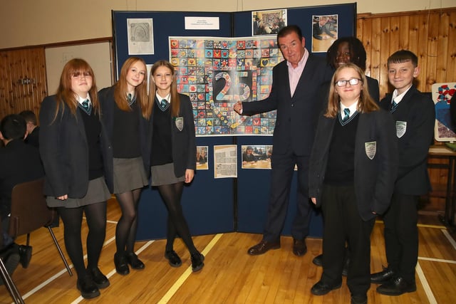 Malone College pupils from south Belfast pictured showing co-founder Tony Carson their winning artwork. The students created an impressive short film entitled ‘Celebrating 25 years of Integration at Malone Integrated College’. Carson Award judges awarded the entry ‘Joint First Prize in Key Stage Three.’