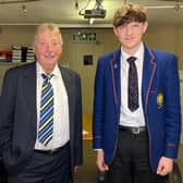 Theo is congratulated by East Antrim MP Sammy Wilson after securing a place on the National Youth Orchestra.