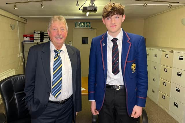 Theo is congratulated by East Antrim MP Sammy Wilson after securing a place on the National Youth Orchestra.