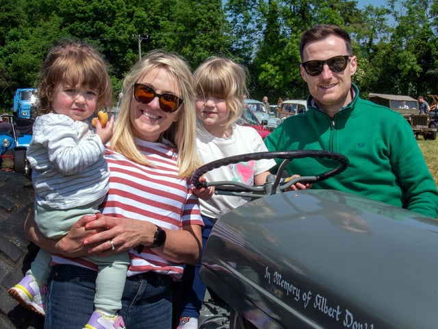 The Croft family posing with a vintage tractor at the Drumcree Parish Garden Fete. Included are, Luna (2), mum, Janet, Eden (4) and dad, Gregory. PT23-229.