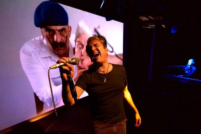 Tim Arnold sings live to film in Super Connected. Photo by Stephen Cassidy