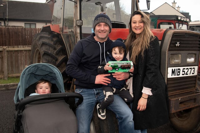 Enjoying the charity tractor run in aid of Dimentia NI in Markethill on Saturday are members of the McIlroy family including, Eliah (11 months), dad, Dale, Joel (2) and mum, Victoria. PT12-275.