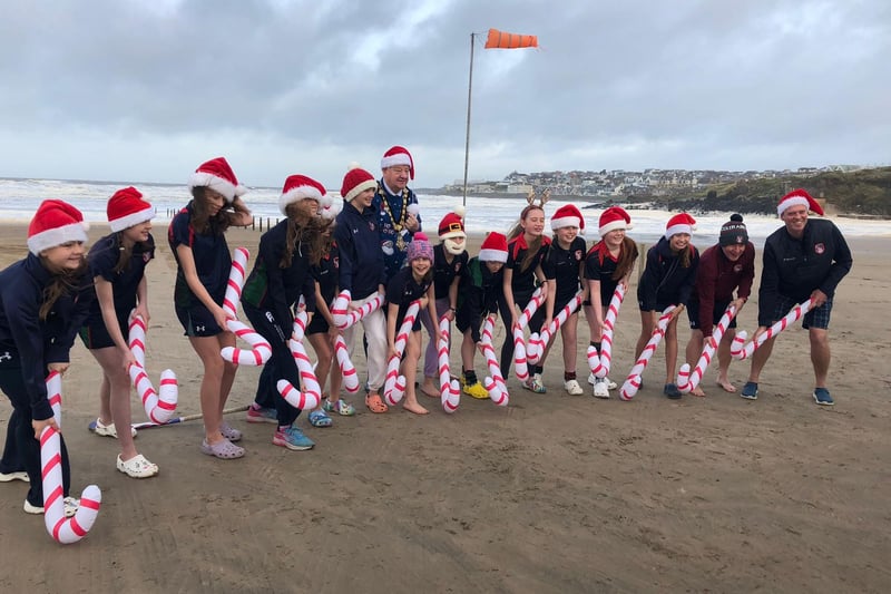 Pictured during their sea dip debut on Portstewart Strand are the brave Year 8 pupils from Coleraine Grammar School; Amber Miller, Anna McGreevy, Elise Archibald, Erin Semple, Eva Grace Patterson, Isabella McCarron, Jasmine Moore, Jessica Cartmill, Josie Dixon, Lucy Blackstock, Poppy Ewing, Sarah McCaughey and Tilly Lyttle. Also included are Mr Semple, Mr Cartmill and mayor of Causeway Coast and Glens, councillor Steven Callaghan