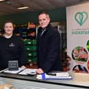 Lynsey Agnew, CEO of Lisburn Community Trust, and volunteer Rebecca Starritt (left) explain to Ciaran Stitt, Housing Executive, how Kickstart Social Supermarket helps vulnerable customers at risk of tenancy breakdown. Pic credit: NIHE