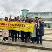 Delegates from Greenland, Ireland, Croatia  with the Workers Party banner showing their solidarity for Palestine.