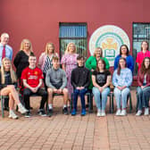 Some of the pupils at St Ronan's College in Lurgan who achieved 8 A grades in their GCSEs. They are pictures with Principal Mrs Fiona Kane and other members of staff.