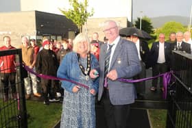 Denis McMacken and Deputy Mayor Margaret-Anne McKillop cut the ribbon at the official opening of Dungiven Bowling Club’s new synthetic bowling green. Credit: Causeway Coast and Glens Borough Council