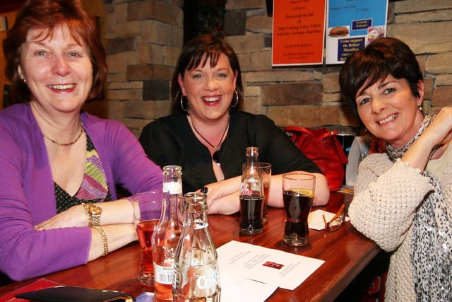 Getting ready for the next question during the table quiz in the Railway Arms, Coleraine, in 2010 in aid of the Haiti Fund were Marlene Oliver, Linda Steele, and Rossnna Morelli