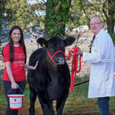 The Forsythe family from Moneymore are raffling Coltrim Evana X74 for charity. Ivan and Nicole Forsythe are pictured with Damien McAnespie, Air Ambulance Northern Ireland . The Laurel House Chemotherapy Unit at Antrim Area Hospital will also benefit from the proceeds of the raffle in memory of Keith Forsythe. Picture: Columba O’Hare/Newry.ie