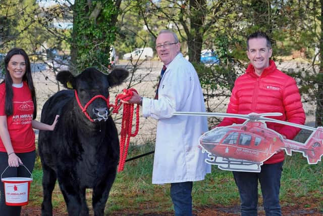 The Forsythe family from Moneymore are raffling Coltrim Evana X74 for charity. Ivan and Nicole Forsythe are pictured with Damien McAnespie, Air Ambulance Northern Ireland . The Laurel House Chemotherapy Unit at Antrim Area Hospital will also benefit from the proceeds of the raffle in memory of Keith Forsythe. Picture: Columba O’Hare/Newry.ie