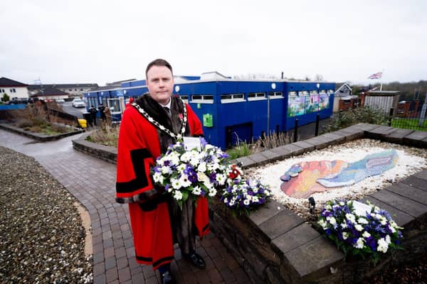 The Mayor of Antrim and Newtownabbey, Councillor Mark Cooper lays a wreath as a mark of respect. Picture: Antrim and Newtownabbey BC.