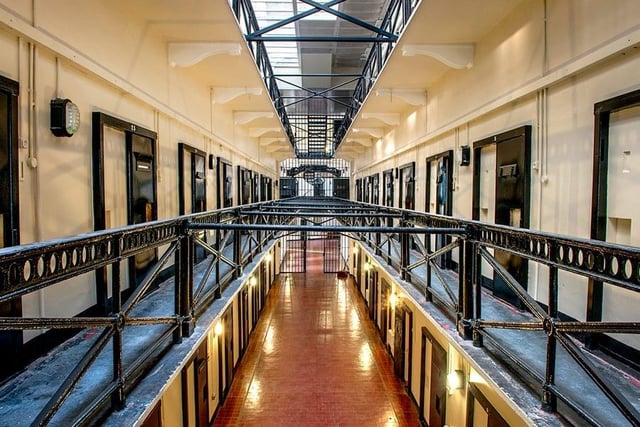 One of Ireland's most famous prisons, used from 1846 to 1996, is now home to one of Belfast’s most popular paranormal tours. Paranormal activity has roamed the building since it closed its doors in 1996, though previous prison officers and prisoners believe it’s been going on a lot longer. 
After the prison closed it was left abandoned for decades, allowing the suspected ghosts to roam freely, until its opening as a museum in 2010. It’s no surprise the building was supposedly left haunted after the prison walls absorbed and witnessed so many years of anger, torment and death. 
When exploring, guests have experienced unexplained sightings and noises, rumoured to be those of the prisoners who never left the site. Some of the alleged experiences include disembodied voices, footsteps, objects moving by themselves and doors slamming with no one around. Regularly paranormal investigators explore the site, with one of the biggest findings taking place Halloween night in 2016. During the investigation it is reported that a heavy steel door closed behind them and a number of strange noises were detected on their equipment.
