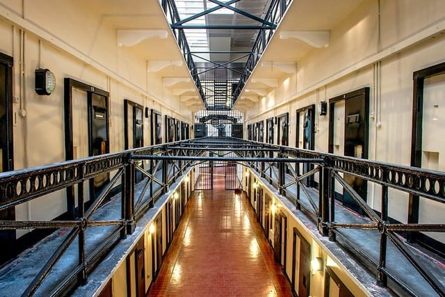 One of Ireland's most famous prisons, used from 1846 to 1996, is now home to one of Belfast’s most popular paranormal tours. Paranormal activity has roamed the building since it closed its doors in 1996, though previous prison officers and prisoners believe it’s been going on a lot longer. 
After the prison closed it was left abandoned for decades, allowing the suspected ghosts to roam freely, until its opening as a museum in 2010. It’s no surprise the building was supposedly left haunted after the prison walls absorbed and witnessed so many years of anger, torment and death. 
When exploring, guests have experienced unexplained sightings and noises, rumoured to be those of the prisoners who never left the site. Some of the alleged experiences include disembodied voices, footsteps, objects moving by themselves and doors slamming with no one around. Regularly paranormal investigators explore the site, with one of the biggest findings taking place Halloween night in 2016. During the investigation it is reported that a heavy steel door closed behind them and a number of strange noises were detected on their equipment.