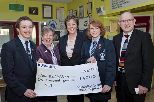 Dromore High School handed over the proceeds from "Christmas by Candlelight" - an evening of carols, readings and music at Dromore Cathedral in 2010. Included are Simon McCracken, Joan Gough (Chairman, Lisburn Branch Save the Children),  Margaret Storey (Head of Music), Rachel Robinson, and John Wilkinson (Headmaster).