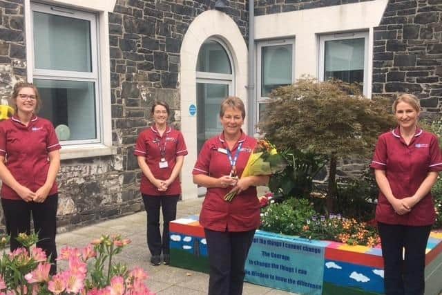Tissue Viability Nurse, Claire Mackin, who is celebrating 40 years in nursing, is pictured alongside other members of the team