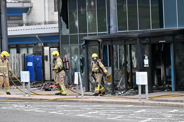 Firefighters at Larne leisure centre after it was attacked in June. Photo: Presseye