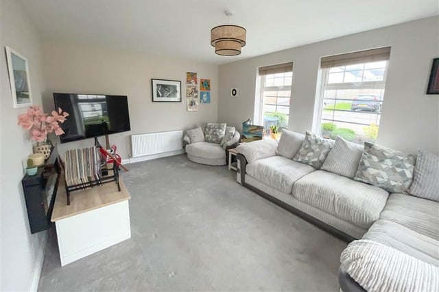 Lounge with twin windows to the front and side.