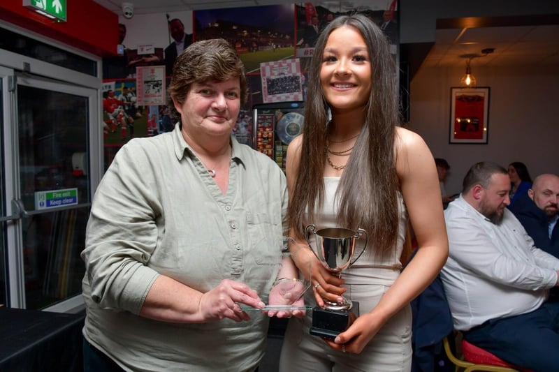 Maggie Crawford presents Jodi McCourt with the Supporters' Olympic Player of the Year Award.