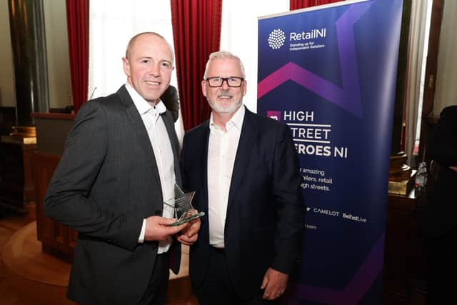 Raymond Millar from The Butchers, Monkstown scooped gold status as Best Butcher at the Retail NI High Street Hero awards 2023. He is pictured collecting the Gold Award from sponsor Harbinson Mullholland.  Picture: Press Eye