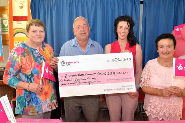 Richmount Rural Community Association, Scotch Street, Portadown, has ave been awarded £257,714 in funding for the next five years by The National Lottery Community Fund. The cheque was handed over in front of a large audience of members and local elected representatives at a celebration afternoon tea dance in the community centre. Pictured  are from left, Geraldine Garvey, ccommittee; Joe Garvey, chairman; Ciara Duffy, funding officer for The National Lottery Community Fund and Letty Houston, committee. PT25-219. Credit: Tony Hendron