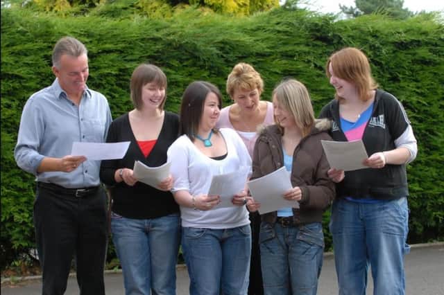 Larne High School acting principal John Armstrong and 6th form co-ordinator Lynne Milligan look over the A Level results with Head Girl Sarah Hill, Lindsay Douglas, Vicky Nelson and Alana Morton in 2007.