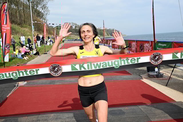 Gladys Ganiel from North Belfast Harriers won the women’s race at the 2025 Kilwaughter Minerals Larne 10 Mile Race. Gladys is pictured crossing the line in a time of 61 minutes and 8 seconds, with fellow North Belfast Harriers runner Eliosa Crawford second and Kathleen Low of Ballymena Harriers finishing third.