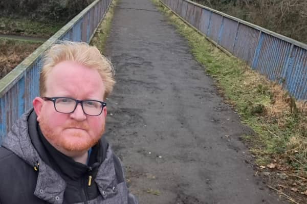 Cllr Gary Hynds at the Blue Bridge as both Lisburn and Castlereagh City Council and Department for Infrastructure deny ownership of the bridge. Pic credit: LDRS