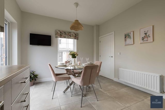 The kitchen diner  (11' 2" x 16' 0") features double patio doors to rear garden and has tiled flooring. Recessed lighting and a TV point for a wall mounted TV add to the features of this lovely practical space.