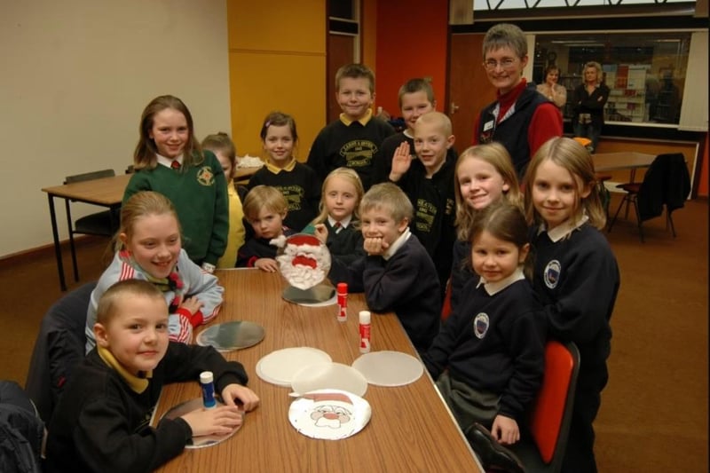 Children take a break from a holiday craft session held in the Larne Library in 2006.