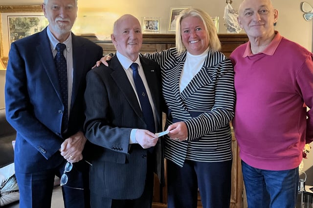 Chairman of the Lisburn and District Masonic Charity Fund, Eddie Carson presented a cheque to representatives from Angel Wishes.