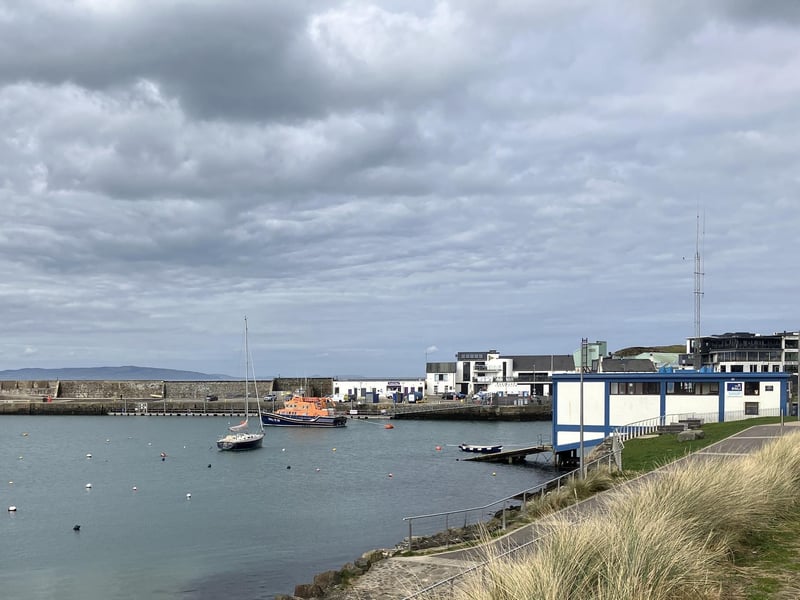 From the 1830s, passenger steamers would sail regularly into Portrush Harbour from ports such as Ardrossan, Ayr, Troon and Glasgow in Scotland with thousands of tourists arriving to enjoy the beautiful scenery and visit the Giant's Causeway. The increase in tourist traffic from Scotland was reflected in the number and size of hotels in the town and Portrush was soon being compared to the famous English resorts, such as Brighton, Scarborough or Bournemouth. The Harbour is now an area buzzing with water sports of all kinds, pubs, restaurants and live music venues. Like most teens from Portrush, I spent a number of summer seasons working in the Harbour pubs and restaurants. Having coped with hugely busy events like the North West 200, Raft Race and the NI Pipe Bands Championships, I'm very happy to be on the other side of the counter these days.