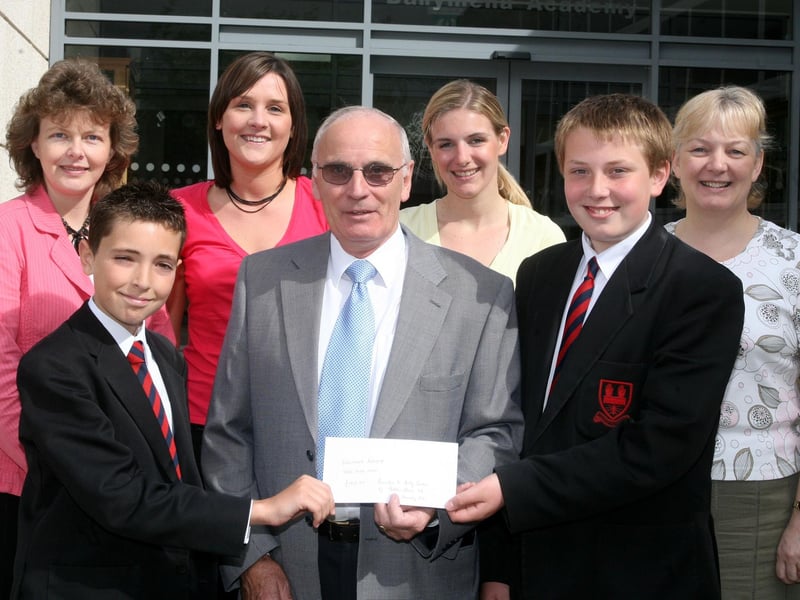 Ballymena Academy pupils Niall Kennedy and Matthew Mairs present a cheque for £1815.85 to Andy Jordon (walk organiser) raised from the annual Tear Fund walk in 2007. Included are teachers Mrs. Lorraine Robinson, Miss Emma Greer, Miss Debbie Clarke and Mrs Dorma Healy. BT27-209AC