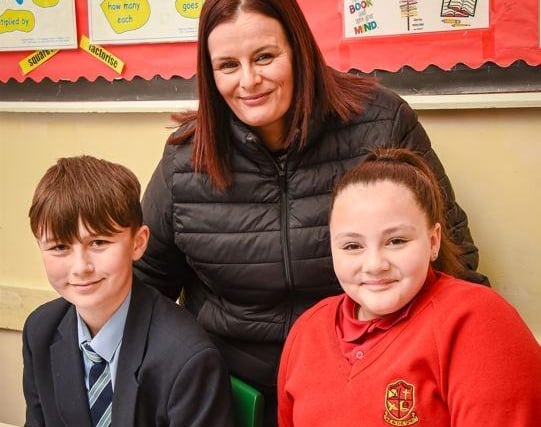 Callum Quinn (Year 8) with Shauna and Eva Maher in the Maths department.