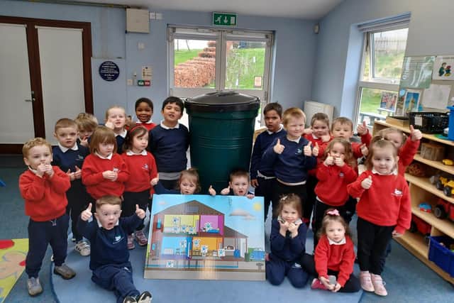 Pictured are pupils from Barbour Nursery with their new Waterbutt.