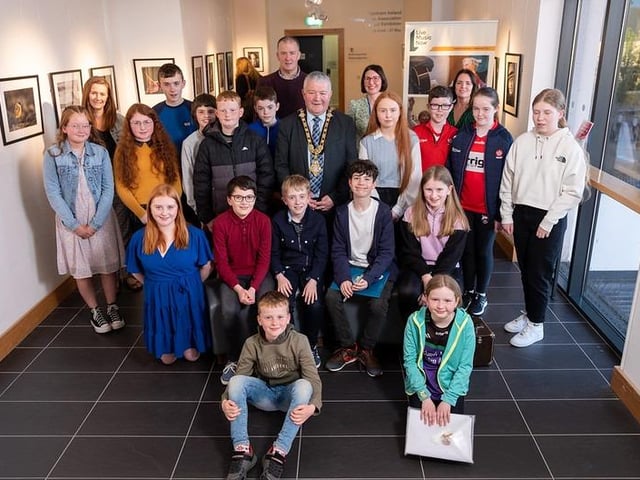 Young Musicians and organisers from Comhaltas Ceoltóirí Éireann - Emma Loughery and Brian McNicoll - with Mayor, Councillor Ivor Wallace, Alice Lewis National Director LMN NI and Shirleen McCann Bank of Ireland