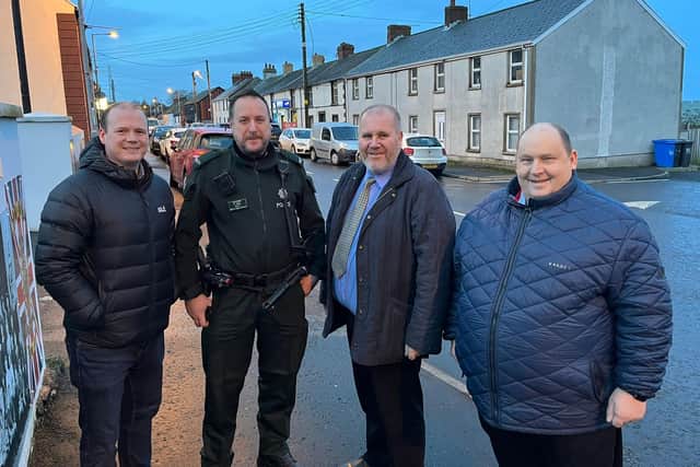 Constable Shaw from Larne Neighbourhood Policing Team with Gordon Lyons MLA and Councillors Paul Reid and Gregg McKeen.
