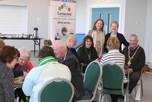 Seated from right: The Mayor Councillor Ivor Wallace enjoying some activities while Fern Major, Chair of Friends of Glenariff and Gabrielle Quinn Community Development Officer, look on. Also getting involved is Yvonne Carson representing Causeway Loneliness Network and members of the community