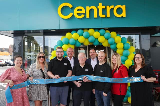 Celebrating the new Centra Scotch Street are (l-r) siblings Christine McNally, Amanda Woolsey, Gordon Woolsey, father Don Woolsey, James Woolsey, Pauline Woolsey and Julie-Ann Liggett. They are joined by Musgrave NI Managing Director Trevor Magill (back, centre left) and Retail Sales Director David Higgins (back, centre right).