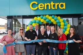 Celebrating the new Centra Scotch Street are (l-r) siblings Christine McNally, Amanda Woolsey, Gordon Woolsey, father Don Woolsey, James Woolsey, Pauline Woolsey and Julie-Ann Liggett. They are joined by Musgrave NI Managing Director Trevor Magill (back, centre left) and Retail Sales Director David Higgins (back, centre right).