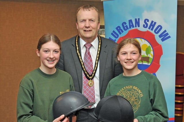 Deputy Lord Mayor of Armagh City, Banbridge and Craigavon, Councillor Tim McClelland with Isabella and Amelia Irwin from Killultagh Pony Club who are competing at Lurgan Show.