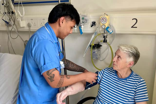 Sherhan Kamlian (Staff Nurse) and patient Sara Milliken. Pic credit: SEHSCT