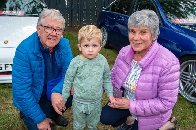 Geoff and Alison Maxwell pictured with grandson Jude Croan (2) at the Waringstown Vintage Cavalcade. LM26-202.