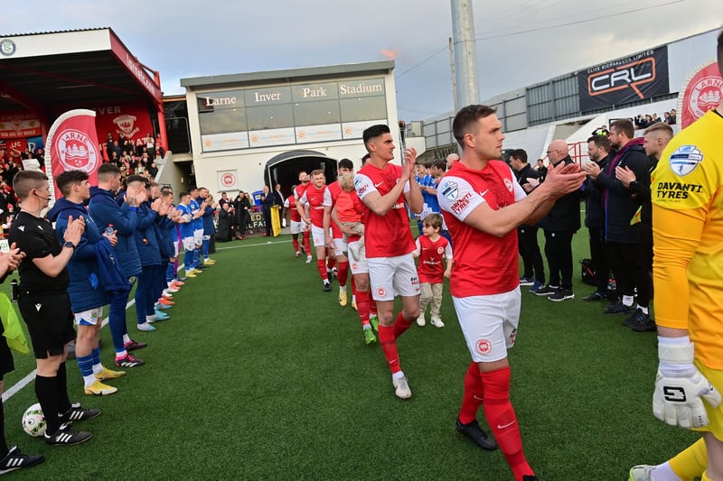 Linfield Players form a guard of honour for Irish League champions Larne before the game.