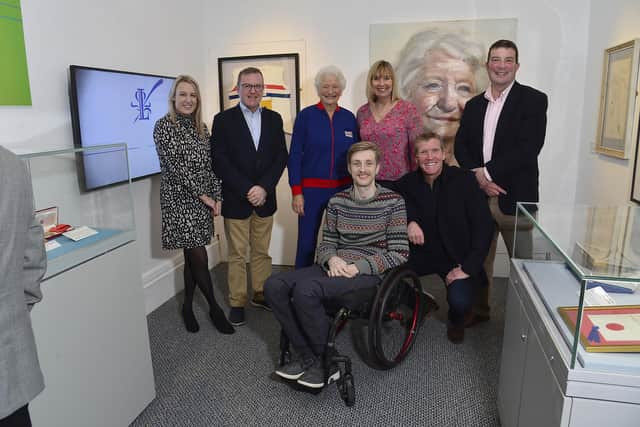 Lady Mary Peters and guests celebrating the launch of the new exhibition at the Lisburn Museum