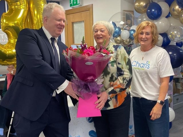 Anne McCrea pictured with John O’Brien and Kathryn Allen, the very first customer in Coagh Pharmacy in 1996.
