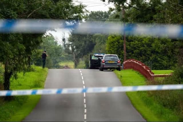Police at the scene following the shooting incident at Maguiresbridge. Picture: Pacemaker