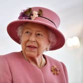 SALISBURY, ENGLAND - OCTOBER 15: Britain's Queen Elizabeth II speaks with staff during a visit to the Defence Science and Technology Laboratory (Dstl) at Porton Down science park on October 15, 2020 near Salisbury, England. The Queen and the Duke of Cambridge visited the Defence Science and Technology Laboratory (Dstl) where they were to view displays of weaponry and tactics used in counter intelligence, a demonstration of a Forensic Explosives Investigation and meet staff who were involved in the Salisbury Novichok incident. Her Majesty and His Royal Highness also formally opened the new Energetics Analysis Centre. (Photo by Ben Stansall - WPA Pool/Getty Images)