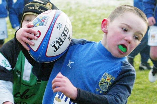 A young Coleraine player presses forward during one of the games at the Mini Rugby Blitz at Coleraine Rugby Club in 2011.