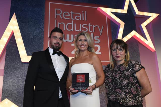 Tym Rees, Suntory Beverage & Food, sponsor of the Retail Industry Awards, presents Michelle Finch of Finch’s SPAR A29 Cookstown with her award for Trailblazer of the Year. Also pictured is awards host Kerry Godliman.